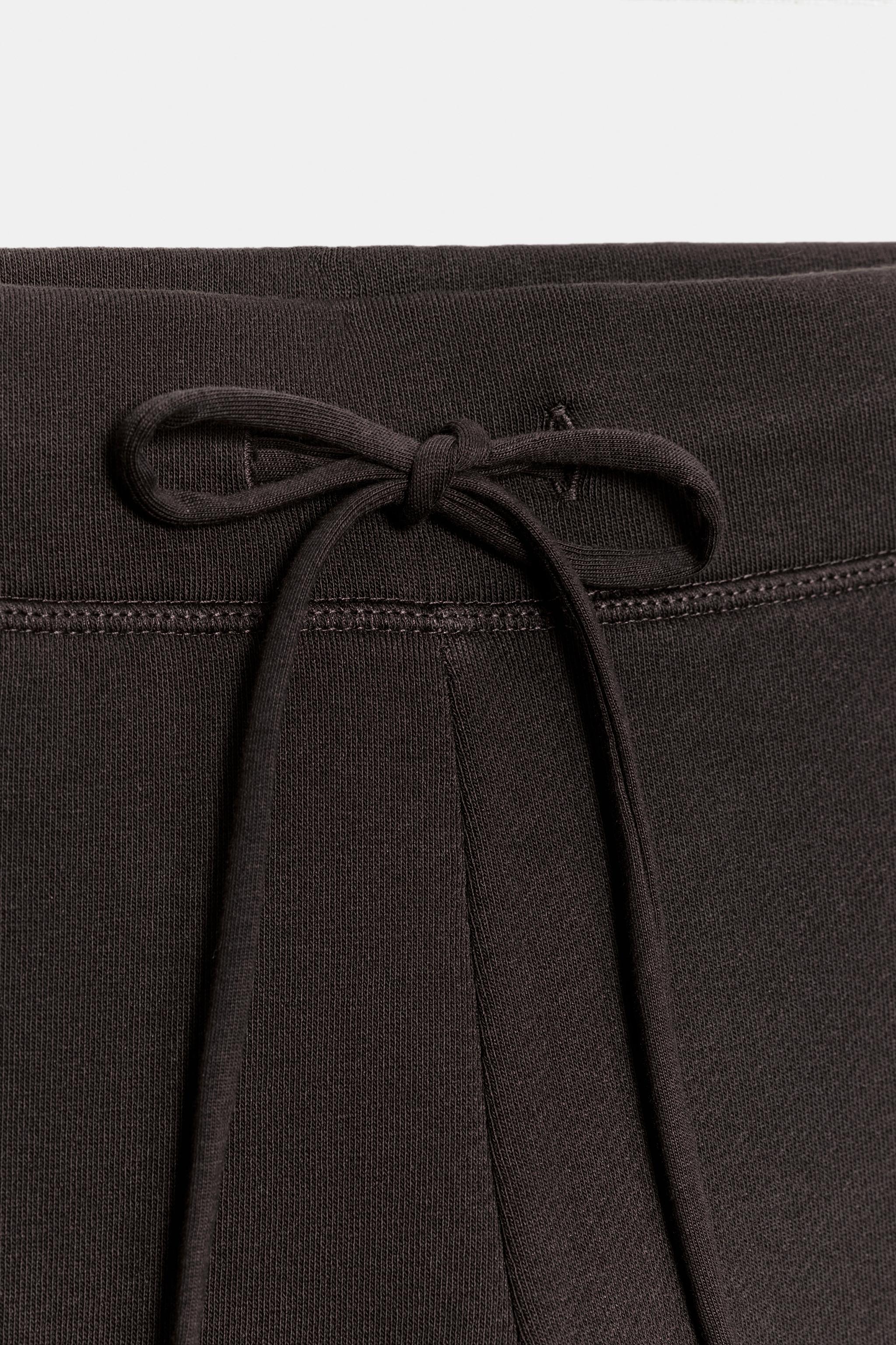 WASHED EFFECT FLARE PANTS